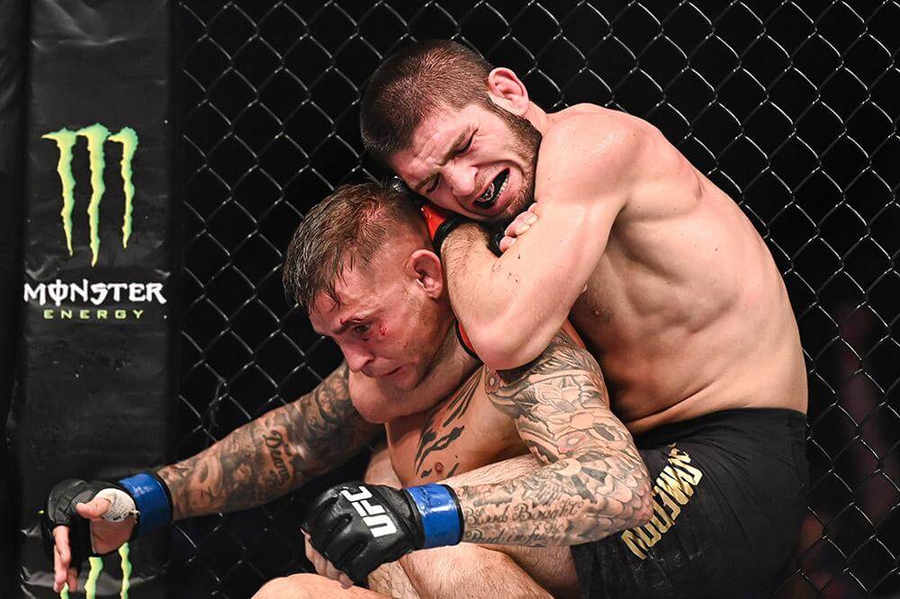 Khabib Nurmagomedov submitting Dustin Porier via rear naked choke.